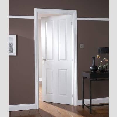 4 panel moulded textured interior door fitted in a dining room